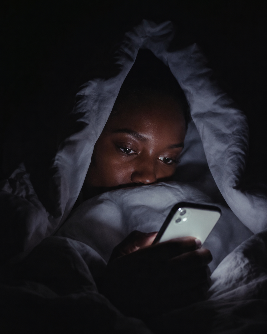 woman in bed undercover
